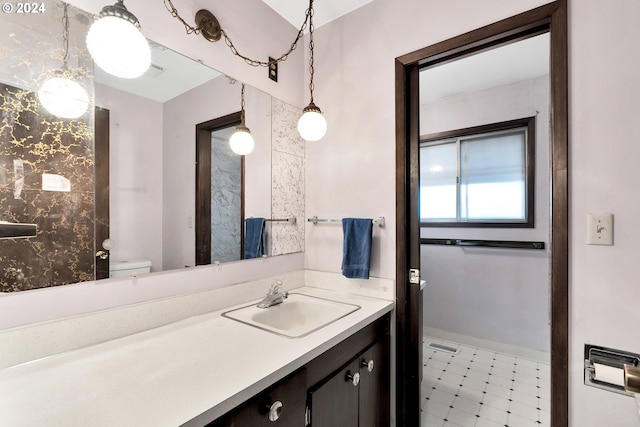 bathroom featuring vanity and toilet