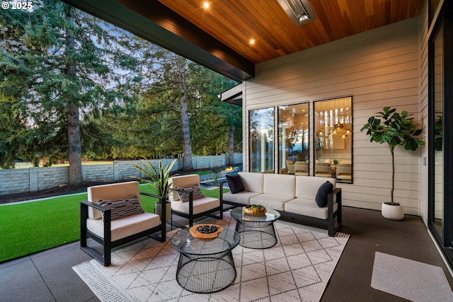 view of patio featuring an outdoor living space with a fire pit