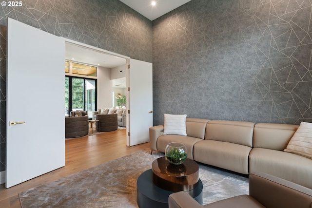 living room featuring tile walls and hardwood / wood-style flooring