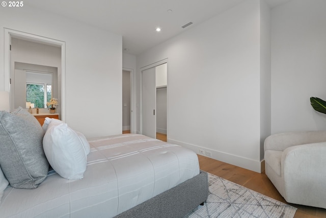 bedroom featuring light hardwood / wood-style floors