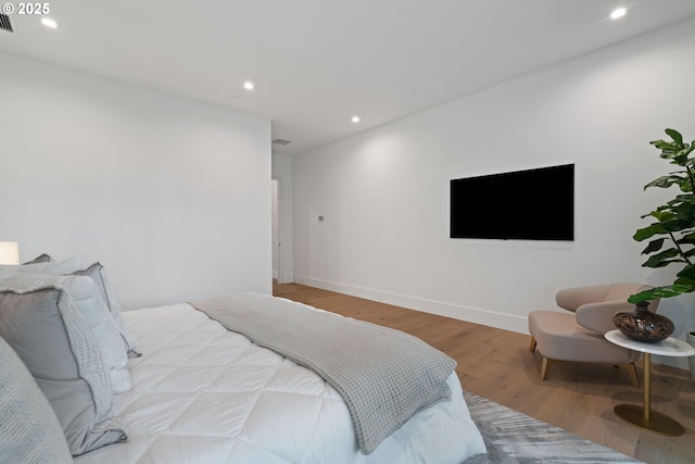 bedroom featuring wood-type flooring