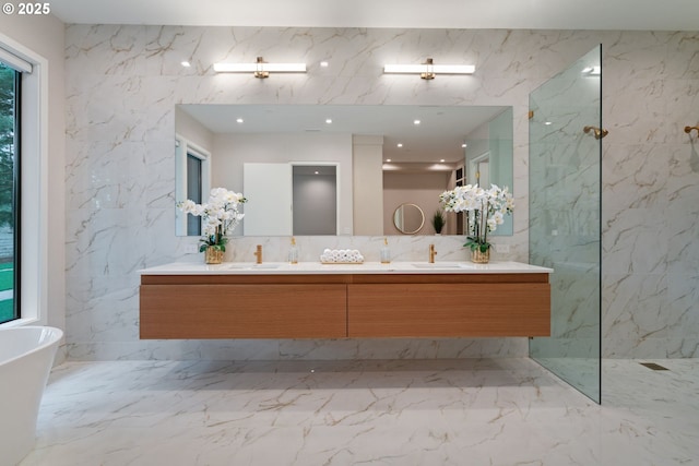 bathroom with vanity, independent shower and bath, and tile walls