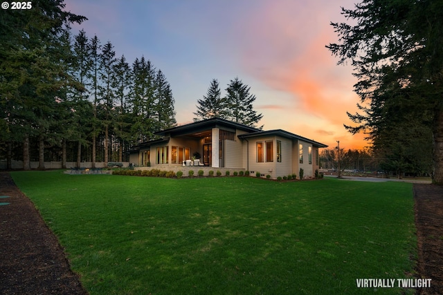 view of front of house with a yard