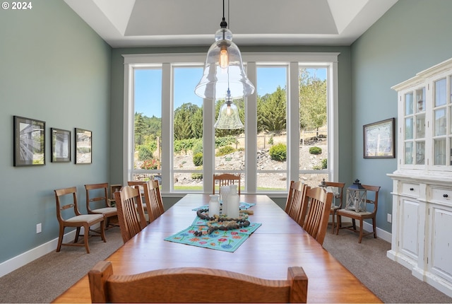 dining area featuring light colored carpet