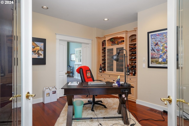 office space featuring dark hardwood / wood-style flooring and french doors