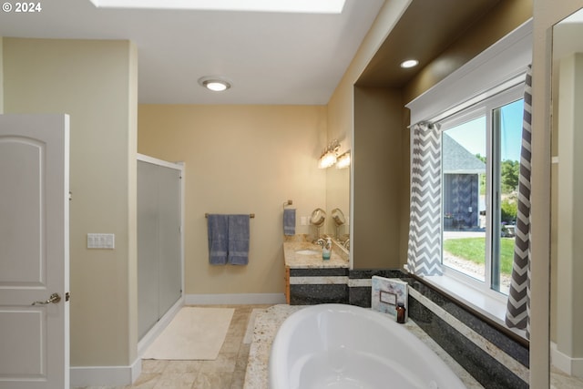 bathroom featuring vanity, separate shower and tub, and tile patterned floors