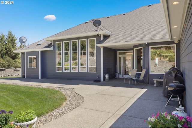 back of house with a patio area