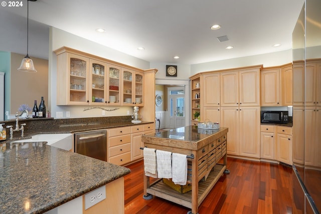 kitchen with sink, decorative light fixtures, light brown cabinets, dark hardwood / wood-style floors, and dishwasher