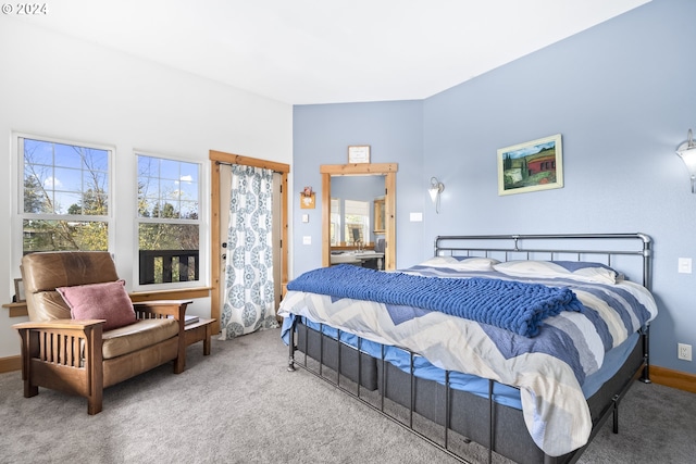 carpeted bedroom featuring baseboards