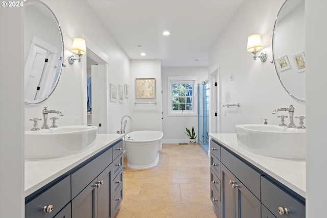 bathroom with a tub to relax in and vanity