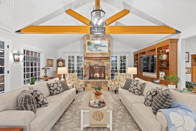 living room featuring wood ceiling, french doors, a stone fireplace, and lofted ceiling with beams