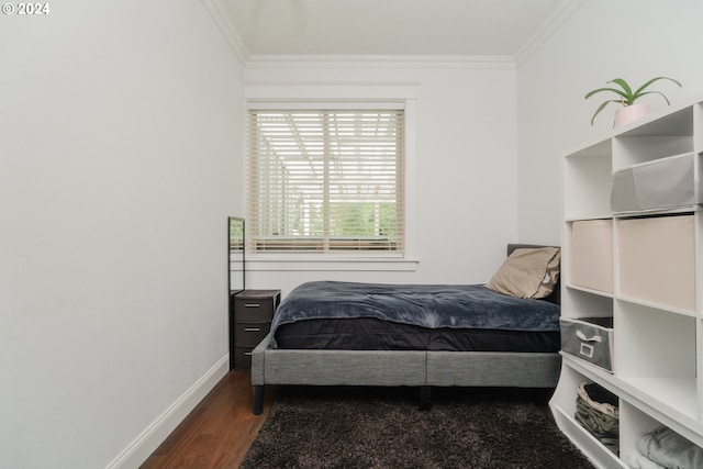 bedroom with ornamental molding and wood-type flooring