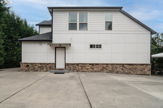 view of home's exterior featuring a patio