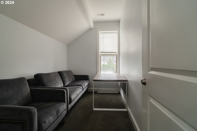 carpeted living room with vaulted ceiling