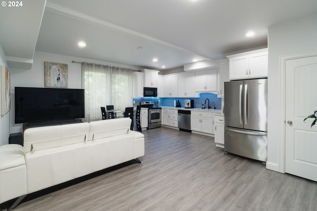 interior space featuring sink and light hardwood / wood-style floors