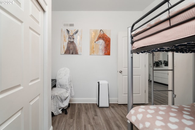 bedroom with light wood-type flooring