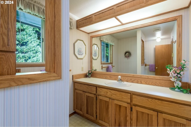 bathroom with vanity and tile patterned floors