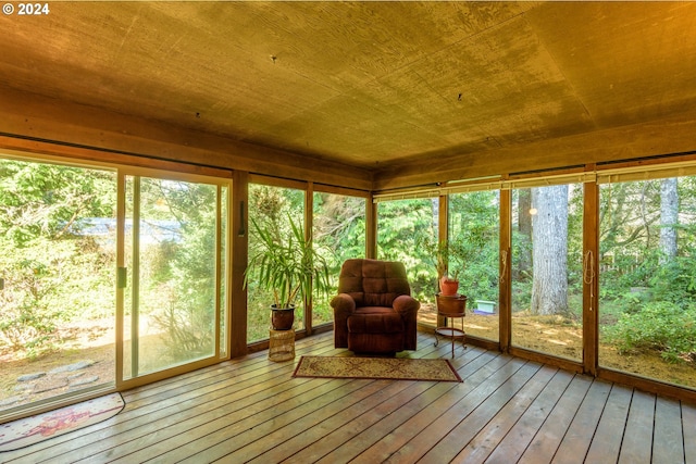 unfurnished sunroom featuring wooden ceiling