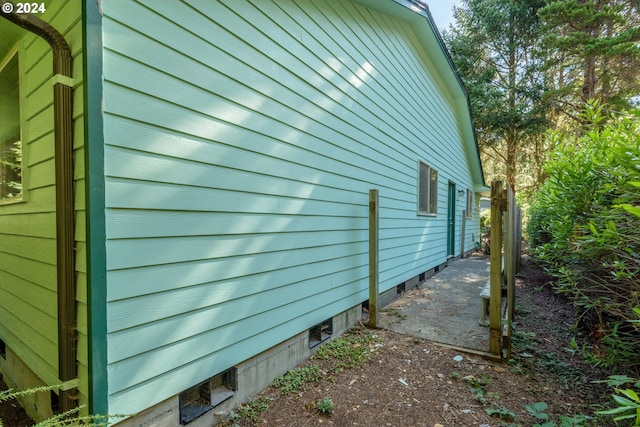 view of side of property with crawl space