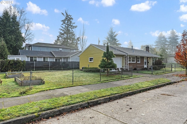 view of side of home with a yard and a garage