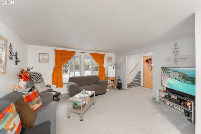 681 Hamlin Dr, Canyonville, OR 97417 - carpeted living room featuring stairs and a textured ceiling