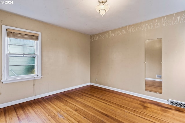 empty room featuring wood-type flooring