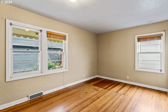 unfurnished room featuring wood-type flooring