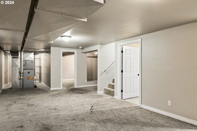 basement with carpet flooring and heating unit