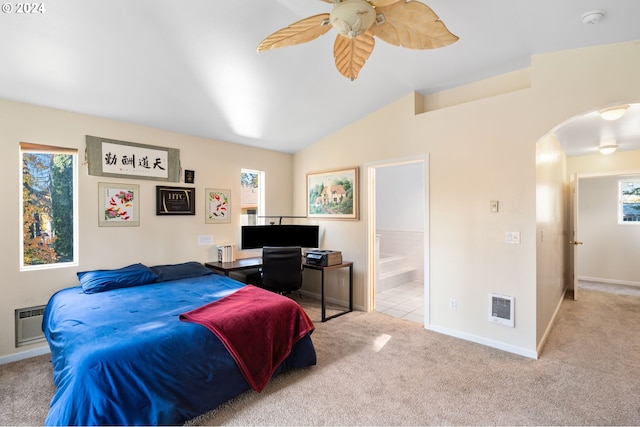 carpeted bedroom featuring connected bathroom, lofted ceiling, ceiling fan, and heating unit