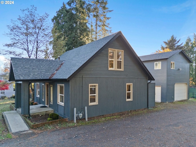 view of side of home featuring a garage