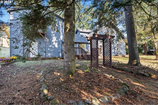 view of yard featuring a wooden deck