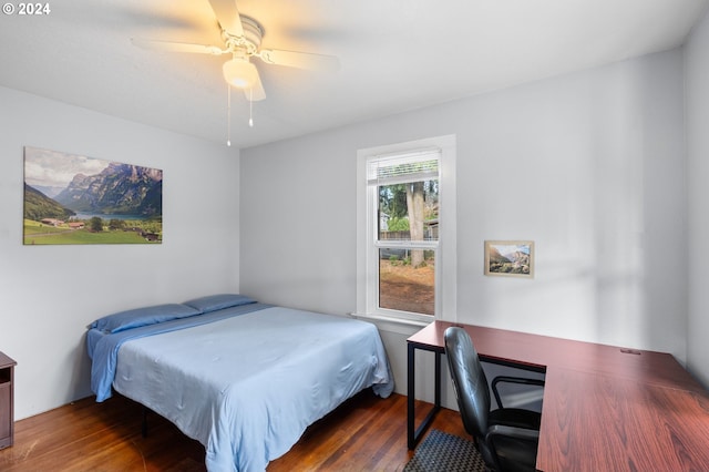 bedroom featuring dark hardwood / wood-style flooring and ceiling fan