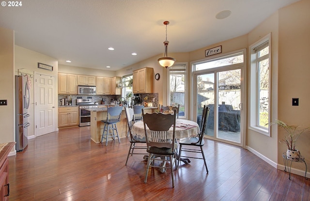 dining space featuring dark hardwood / wood-style floors