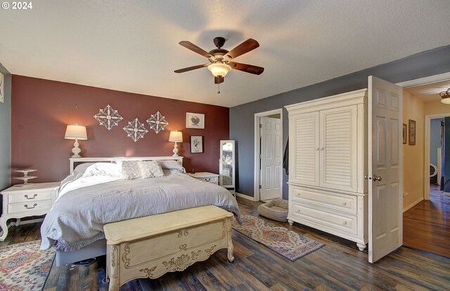 bedroom featuring a textured ceiling, dark hardwood / wood-style flooring, and ceiling fan