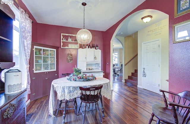 dining space with dark hardwood / wood-style floors