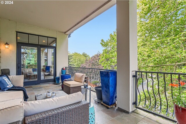 707 N Hayden Island Dr Unit 301, Portland, OR 97217 - balcony featuring an outdoor living space and french doors