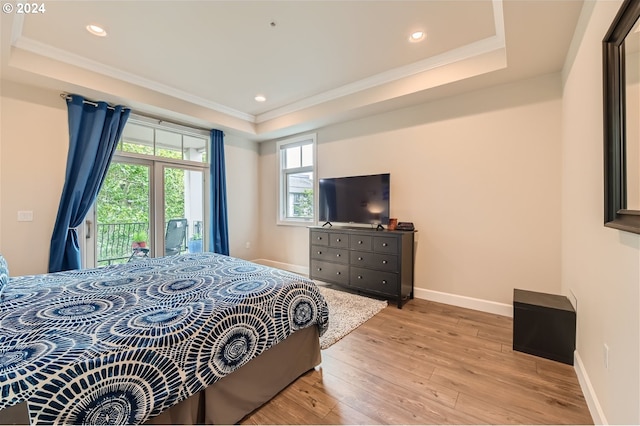 707 N Hayden Island Dr Unit 301, Portland, OR 97217 - bedroom featuring a tray ceiling, access to outside, light wood-type flooring, crown molding, and recessed lighting
