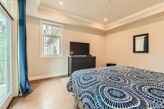 707 N Hayden Island Dr Unit 301, Portland, OR 97217 - bedroom with ornamental molding, multiple windows, light wood finished floors, a tray ceiling, and recessed lighting