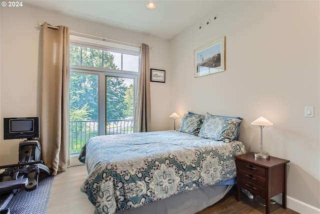 707 N Hayden Island Dr Unit 301, Portland, OR 97217 - bedroom with wood finished floors and baseboards
