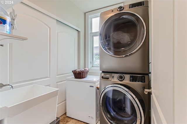 707 N Hayden Island Dr Unit 301, Portland, OR 97217 - laundry area featuring stacked washing machine and dryer and healthy amount of natural light