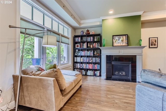 707 N Hayden Island Dr Unit 301, Portland, OR 97217 - living room featuring ornamental molding, a tile fireplace, wood finished floors, and recessed lighting