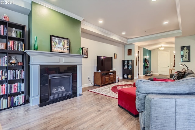 707 N Hayden Island Dr Unit 301, Portland, OR 97217 - living room with wood finished floors, crown molding, a fireplace, a raised ceiling, and recessed lighting