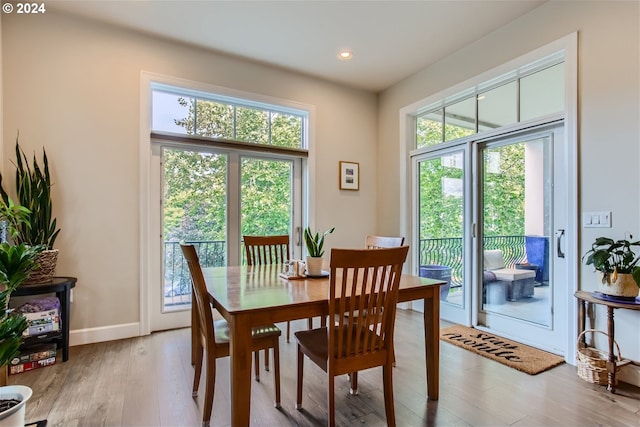 707 N Hayden Island Dr Unit 301, Portland, OR 97217 - dining room with wood finished floors, recessed lighting, and baseboards