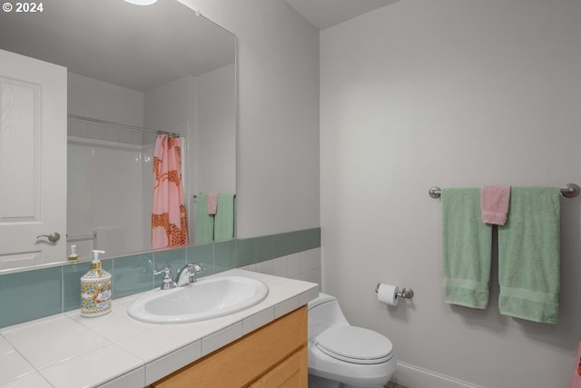 bathroom with vanity, toilet, and a shower with curtain