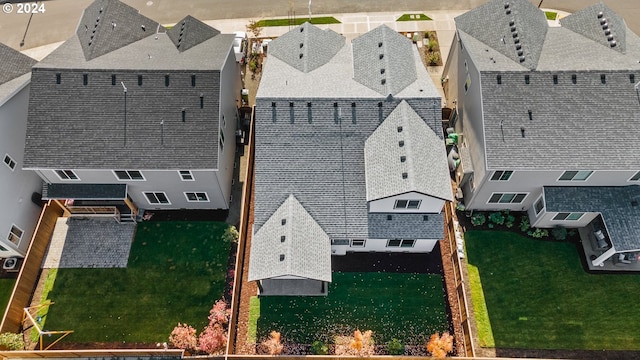 rear view of property with a lawn and a patio