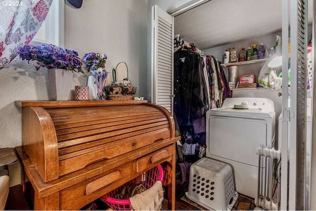 washroom featuring a textured ceiling and washer / clothes dryer