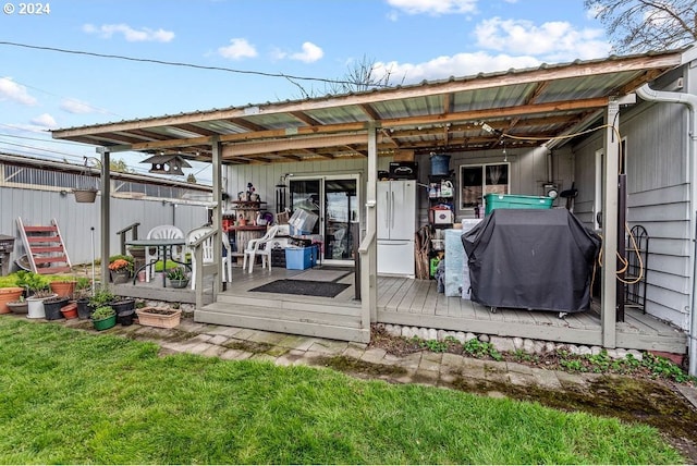 exterior space featuring a yard and a wooden deck