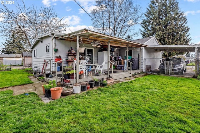 back of house with a yard and a carport