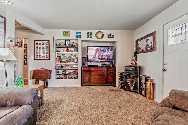 carpeted living room featuring a textured ceiling