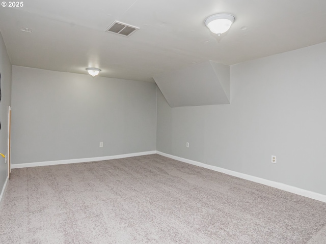 bonus room with carpet and lofted ceiling